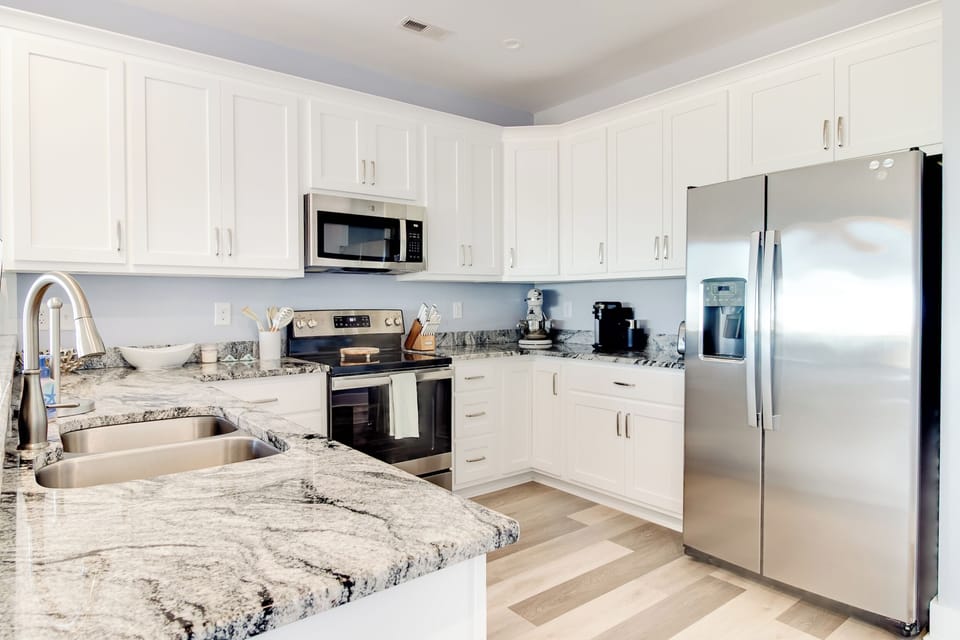 A bright, fully equipped kitchen with modern appliances and plenty of counter space makes cooking and gathering effortless during your stay