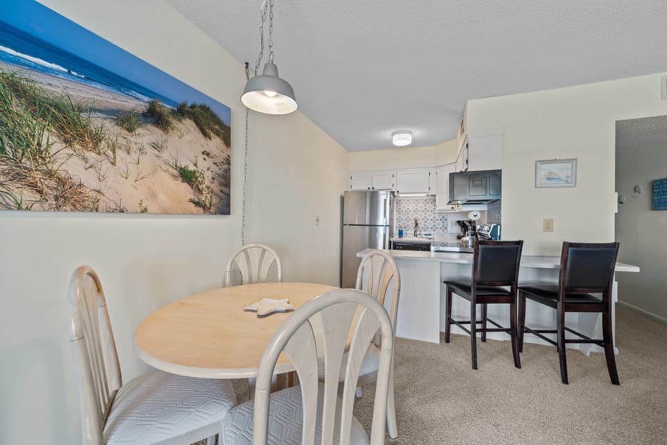 Casual dining nook paired with a breakfast bar—easy for quick bites or lingering conversations