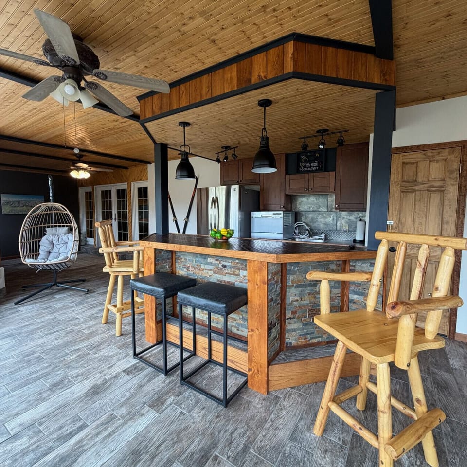 Spacious sunroom with wet bar