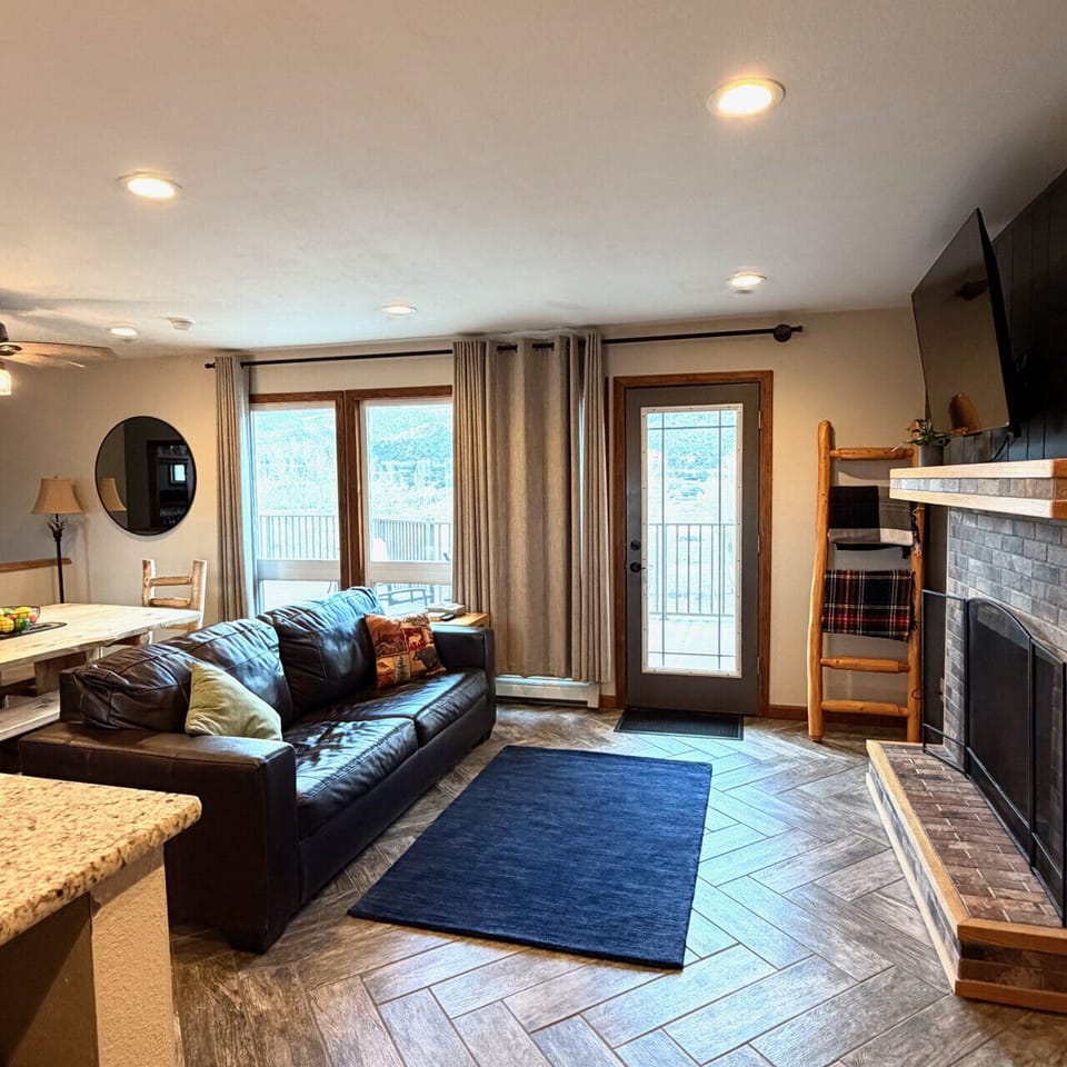 Living room with real leather convertible queen sofa bed