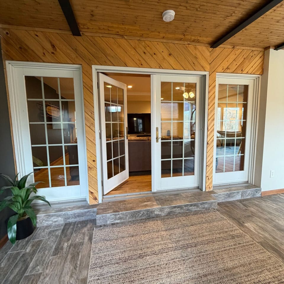 Doors from the media room to the sunroom