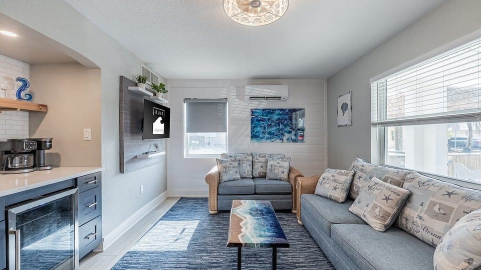 Gather on cozy sofas and enjoy bright, beachy vibes