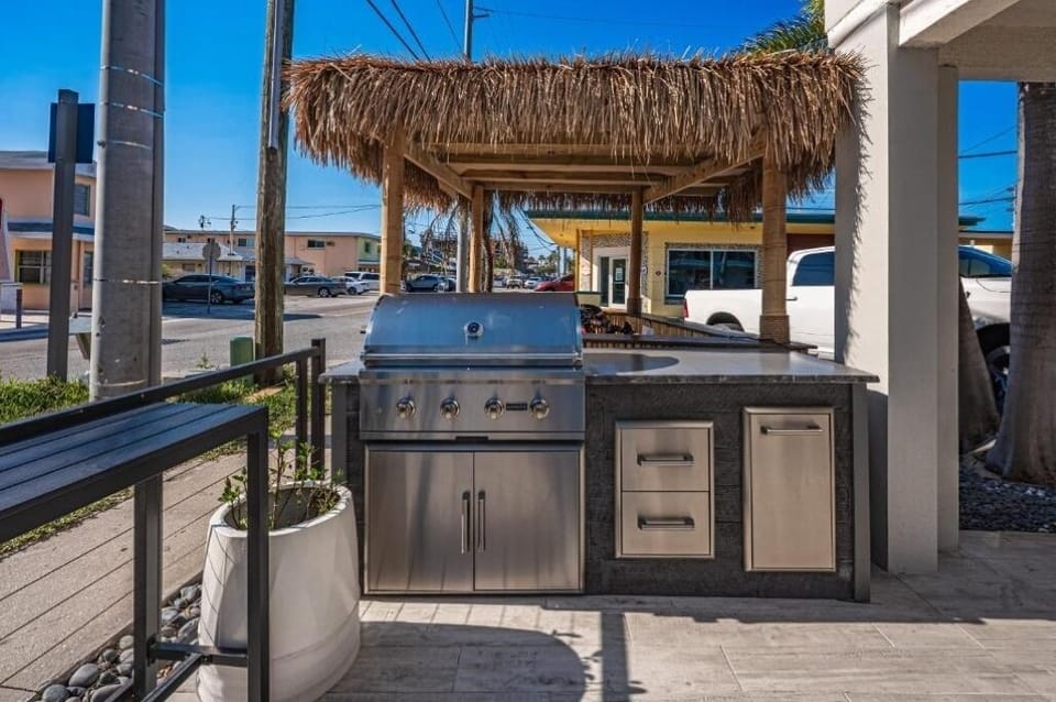 Fire up the grill for sunny cookouts under tiki shade.