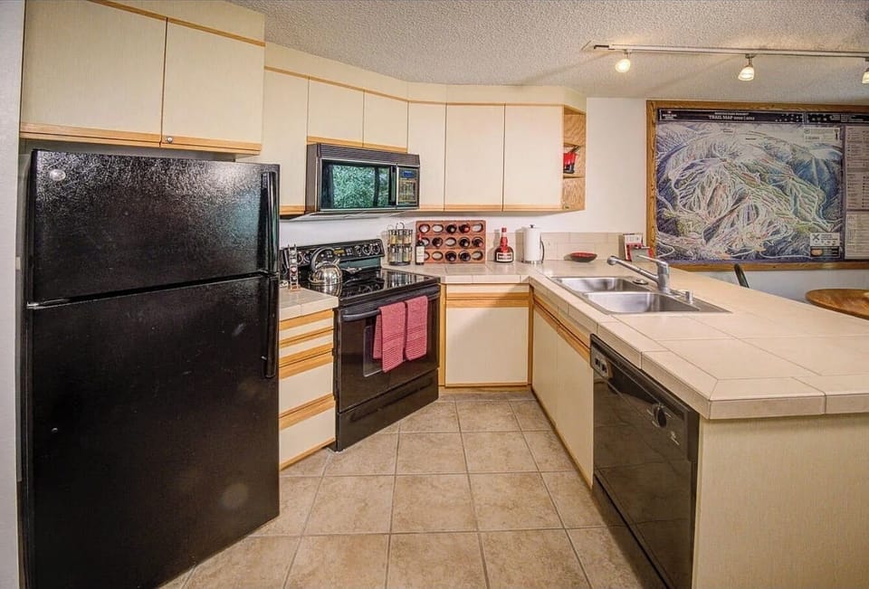 Full-sized and fully stocked kitchen makes for easy cooking. 