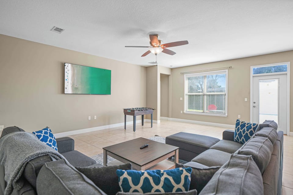 Living Room Section Couch w/ Smart TV & Foosball Table