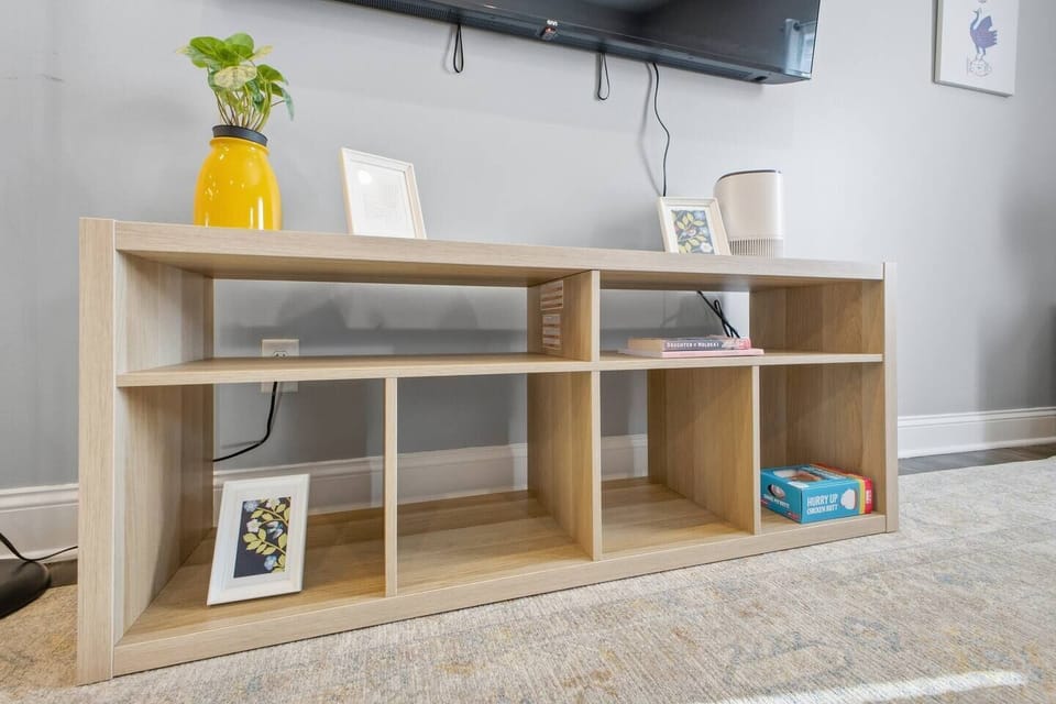Modern media console with games and books for cozy nights in
