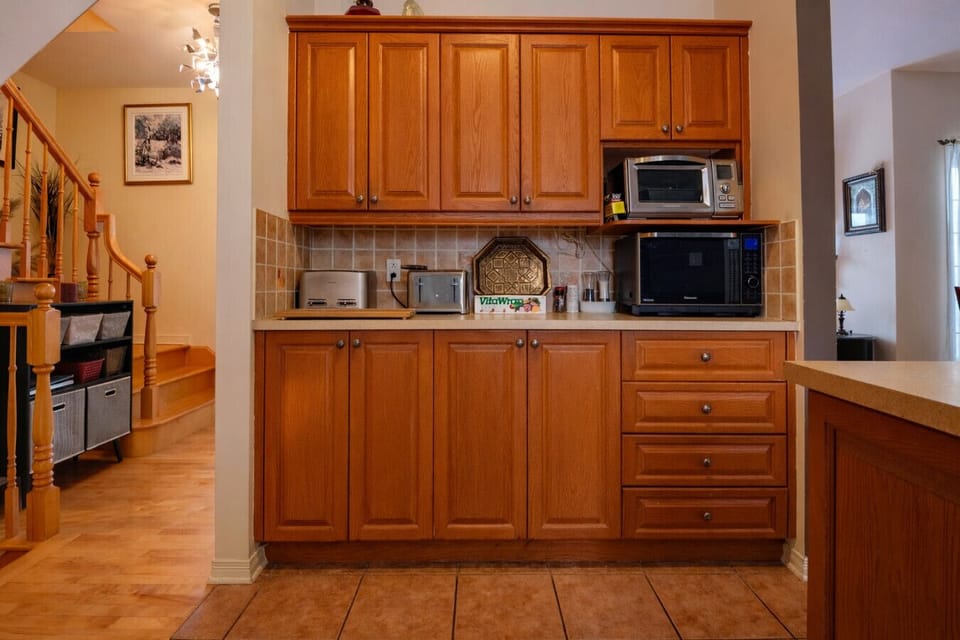 Kitchen area with ample storage and a spacious worktop
