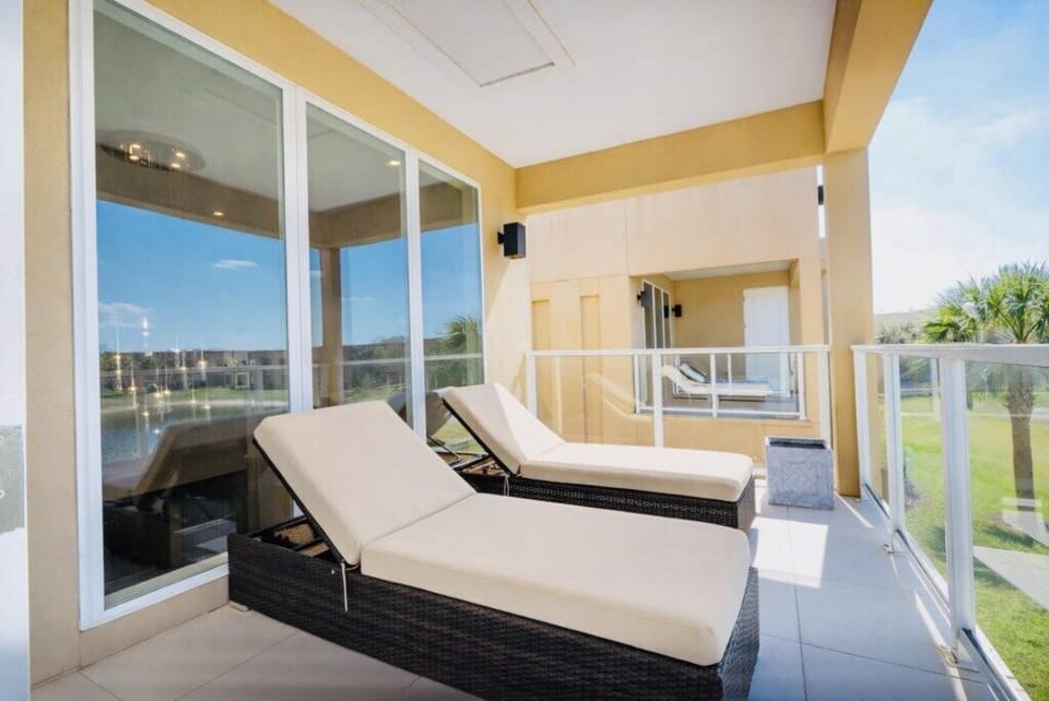 Bright balcony with wicker lounges