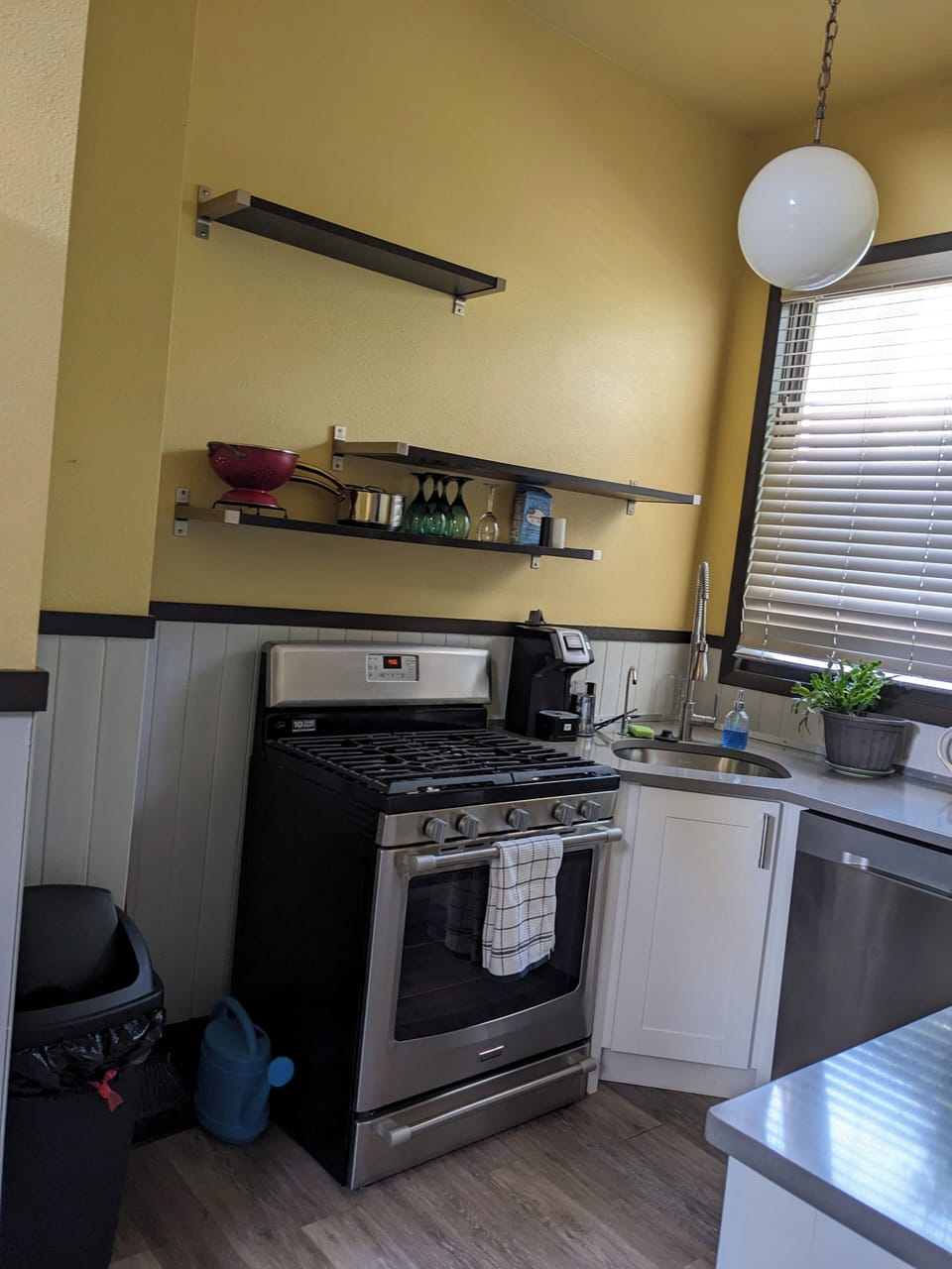 Full stove/oven, wine glasses, cookware, sink, filtered water dispenser attached