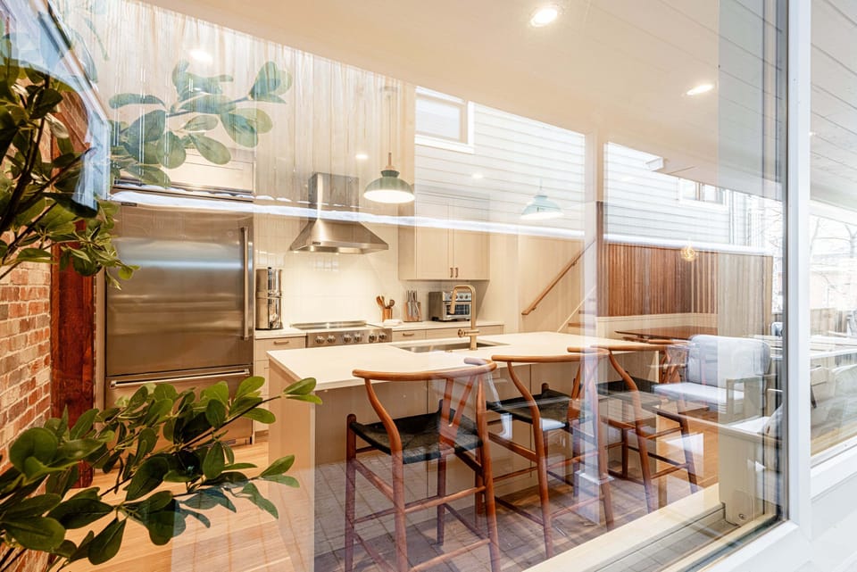 Open kitchen and dining area with warm natural light