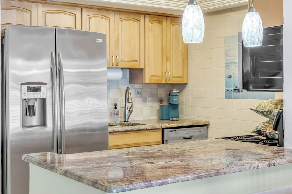 The updated kitchen features stainless steel appliances and is fully equipped, making it easy to prepare meals and enjoy your Flagler Beach stay