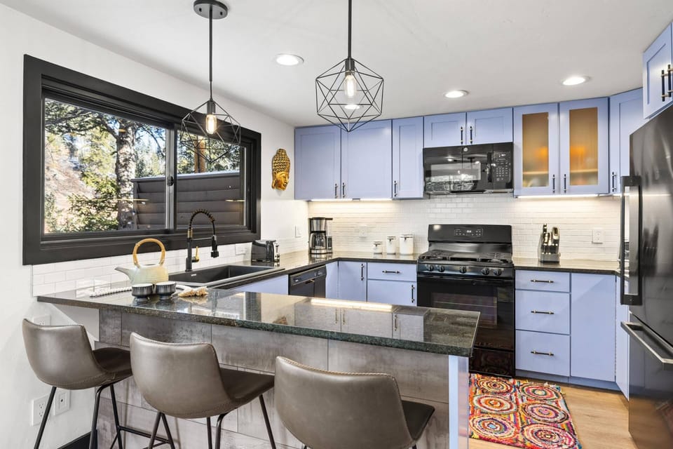 The kitchen is fully stocked with everything you need to cook a meal or just hang out by the bar and enjoy the views!