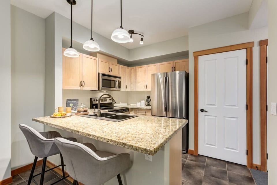 Kitchen island has seating for 2.