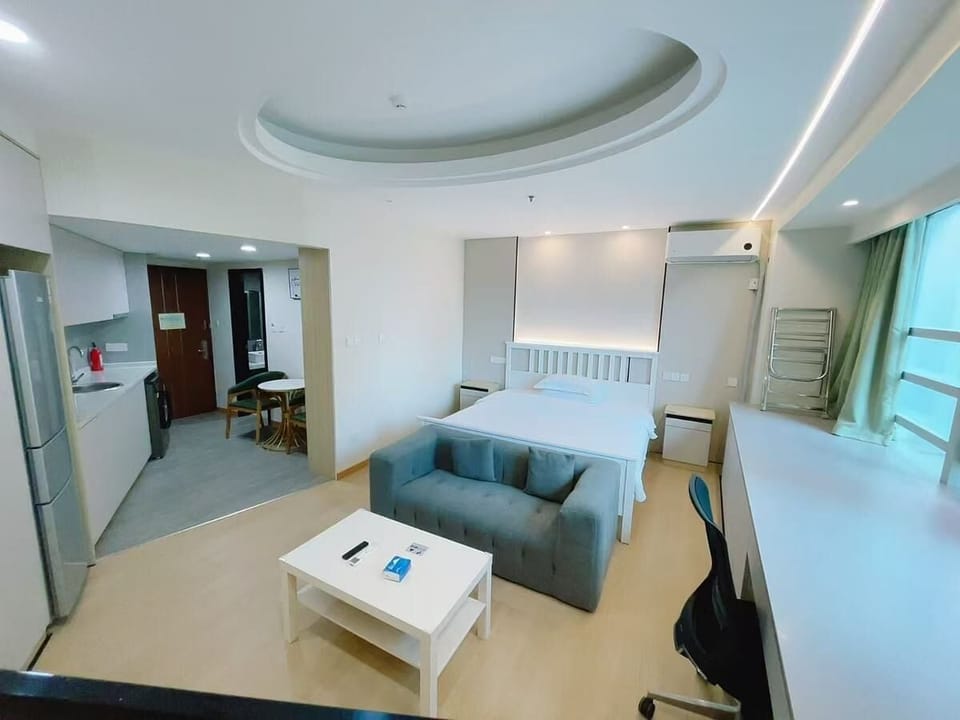 Executive Studio Suite, City View | Living area | 43-inch LED TV with cable channels, TV