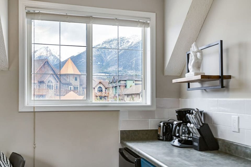 Kitchen space with cooking essentials and mountain views