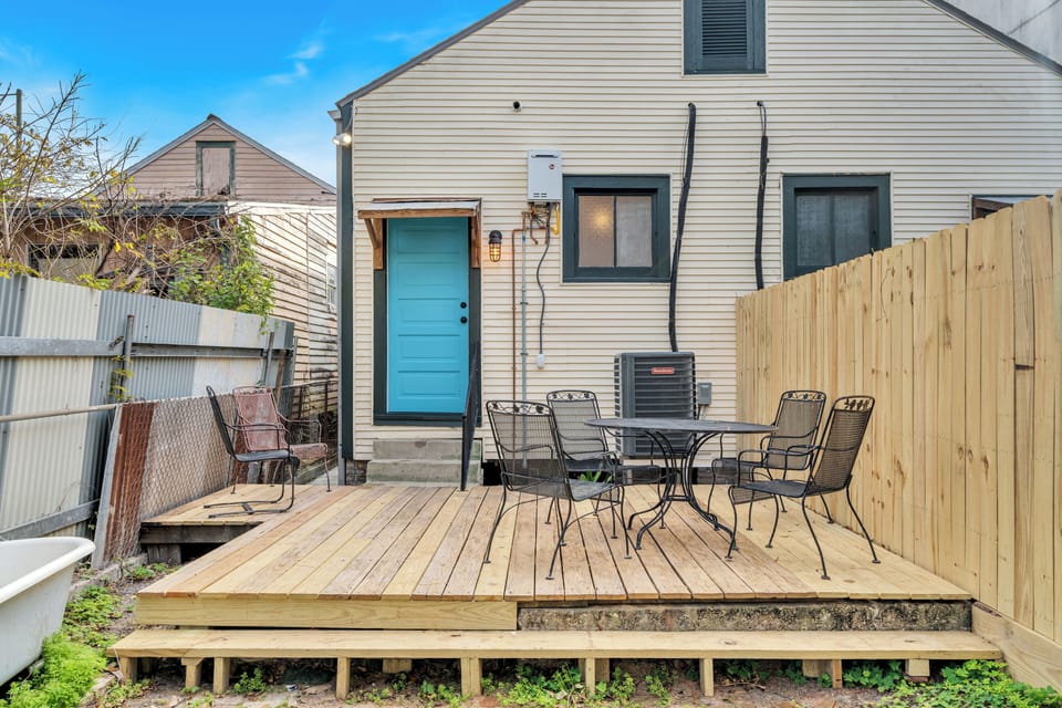 Outdoor patio with seating and grill area