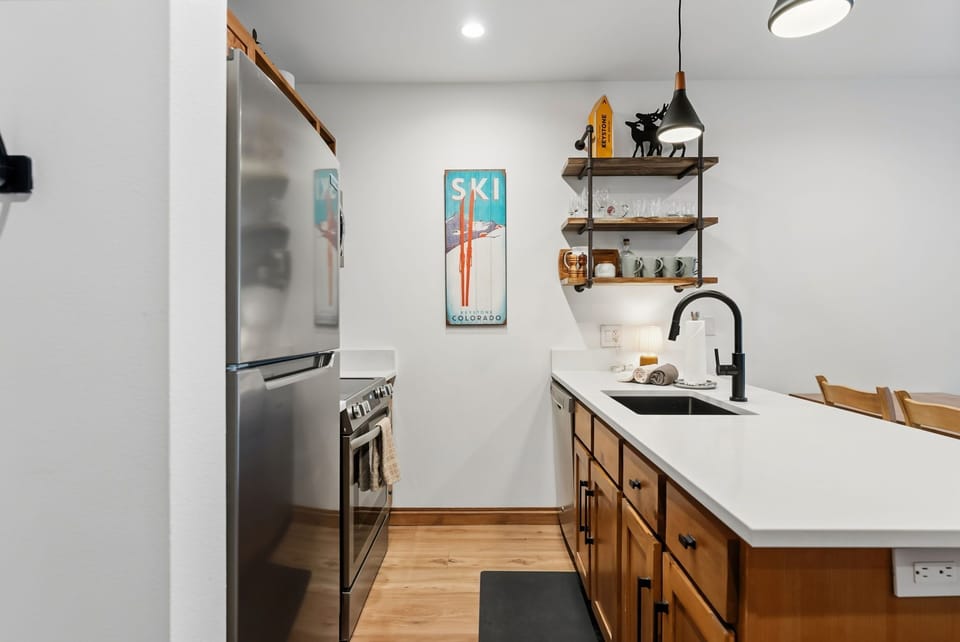 Your modern kitchen awaits with sleek appliances, warm wood cabinets, and thoughtful touches that make cooking feel like home.