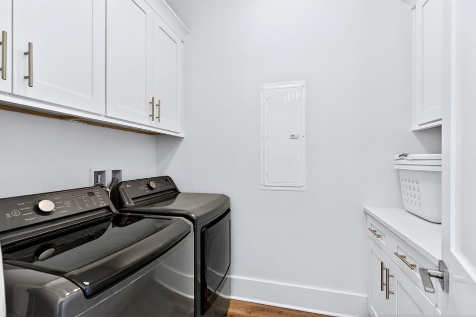 1st floor - Convenient laundry room equipped with full-size washer and dryer—perfect for longer stays, beach days, and keeping everyone refreshed throughout your Miramar Beach getaway.