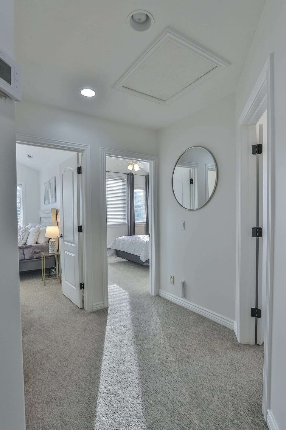 Hallway at the top of the stairs to additional 3 upstairs bedrooms and full bathroom