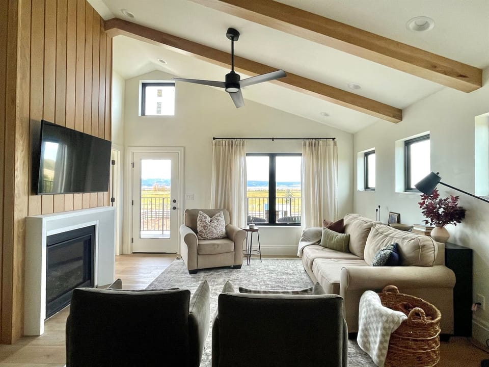 Living room with TV & gas fireplace