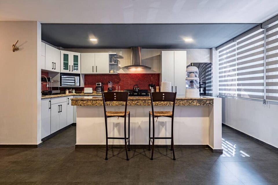Breakfast bar with seating and plenty of prep space for group meals