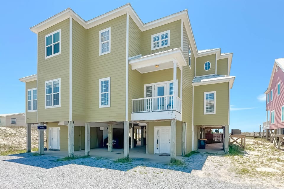 Spacious coastal home just steps from the beach with multiple private balconies.