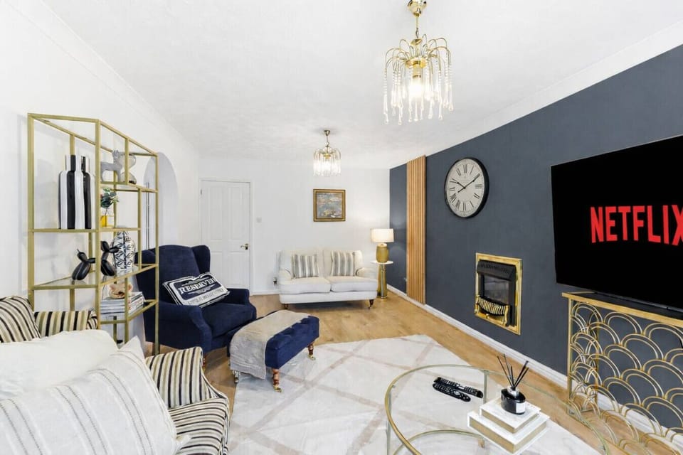 Relax in the inviting living room, complete with comfortable seating and a 60-inch Smart TV, with Sky TV and Netflix included for your entertainment.