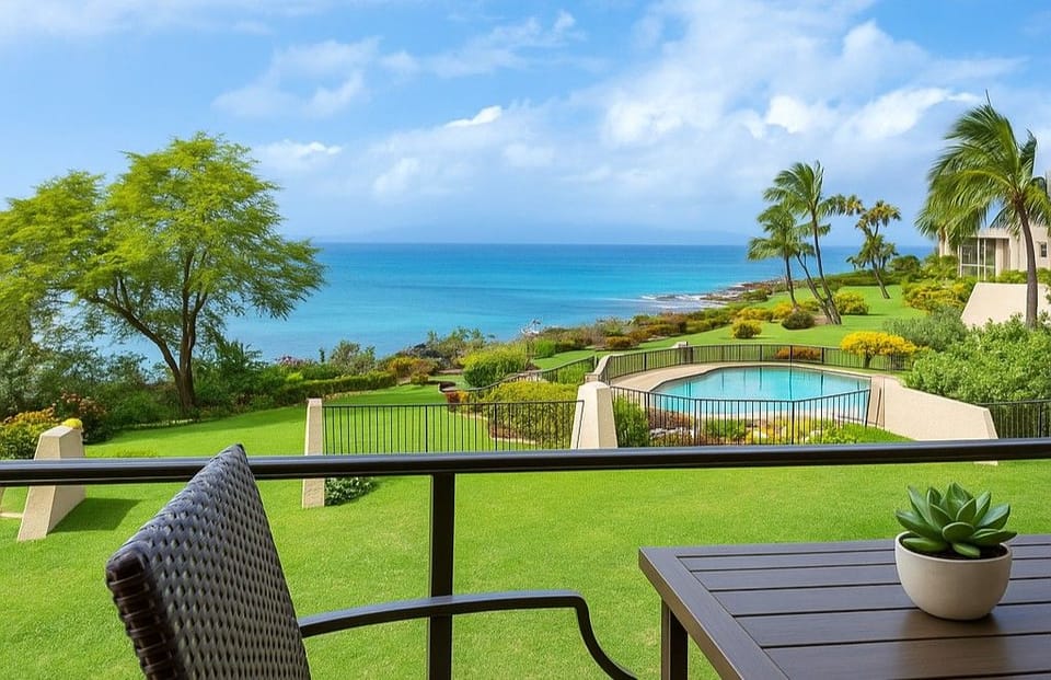 Peaceful ocean-view pool at Napili Point with loungers and umbrellas, set above the rocky shoreline for quiet swims and postcard-worthy sunset views.