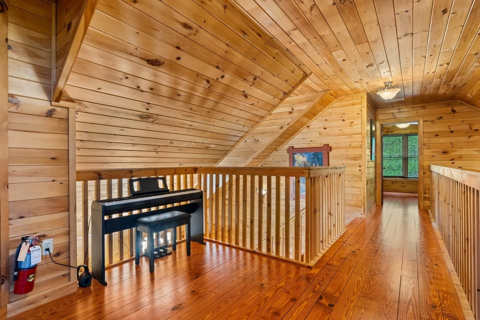Upper level loft space with piano. Plan your sing-a-longs now!