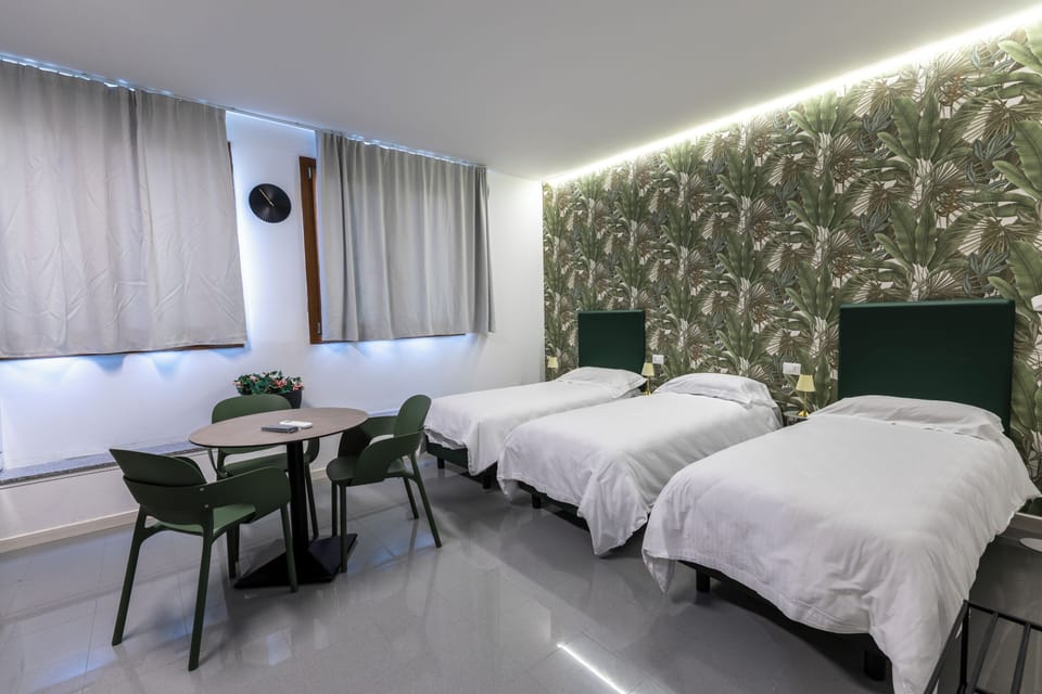 Down comforters, pillowtop beds, in-room safe, blackout drapes