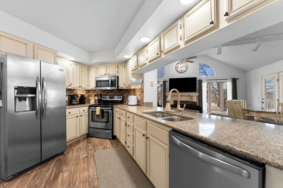 Fully stocked kitchen with stainless appliances