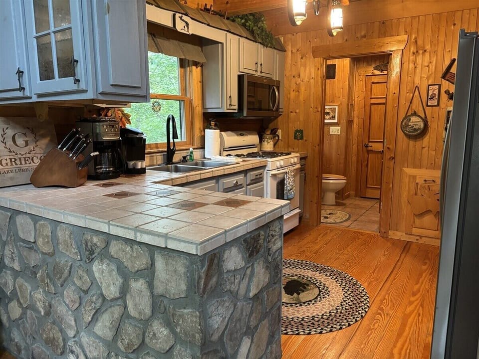 Kitchen area with an adjacent half bath