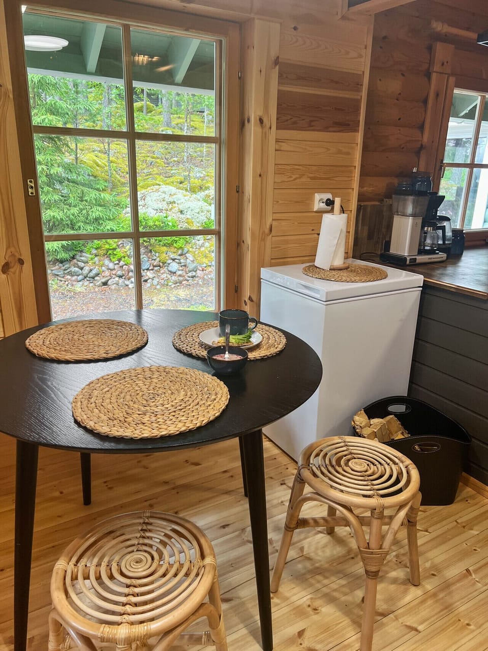 njoy your breakfast with a view; this cozy dining spot brings the beauty of the Finnish forest right to your table.