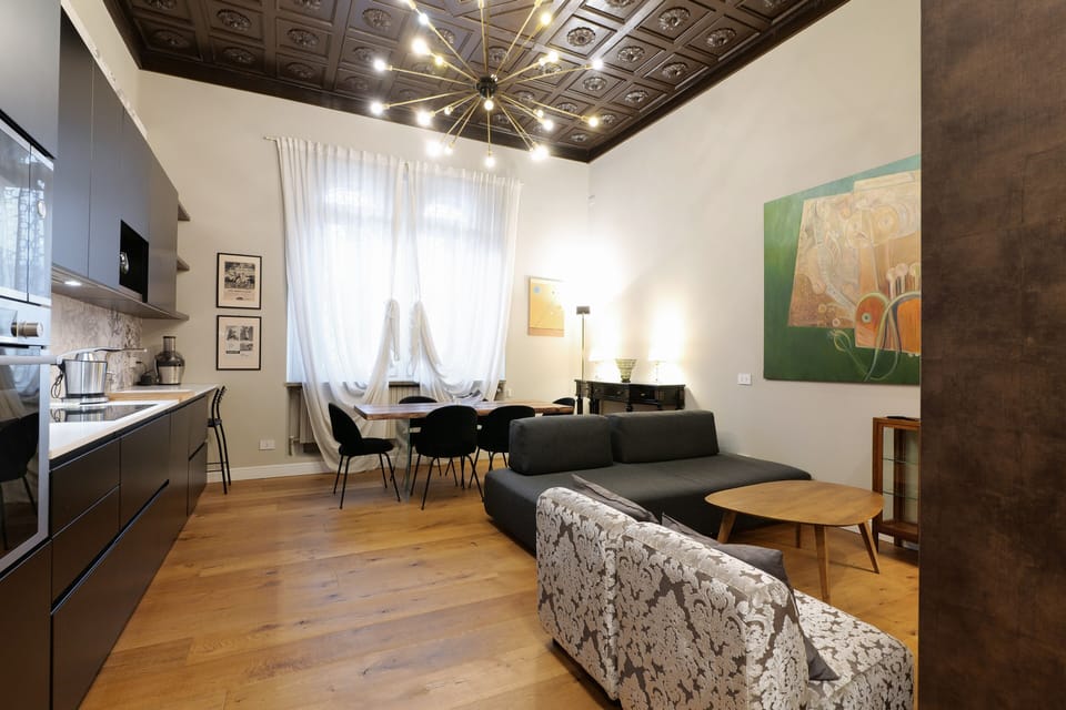 Apartment (Pisacane) | Down comforters, minibar, individually decorated, individually furnished