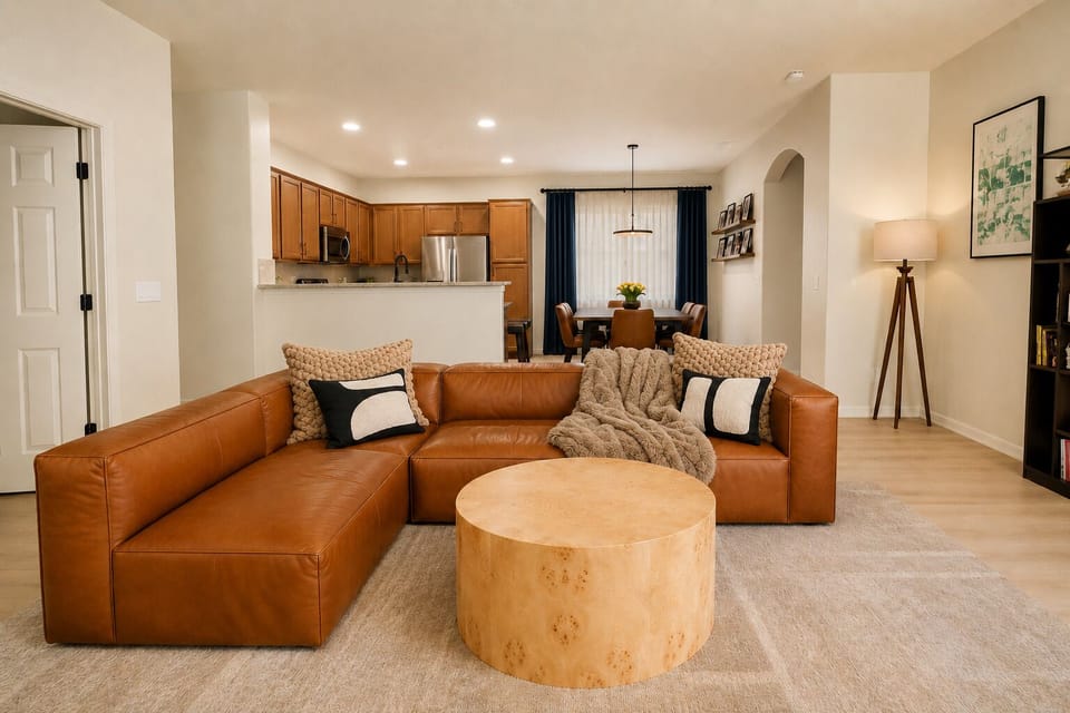View of the living room looking into the open concept kitchen and dining room.