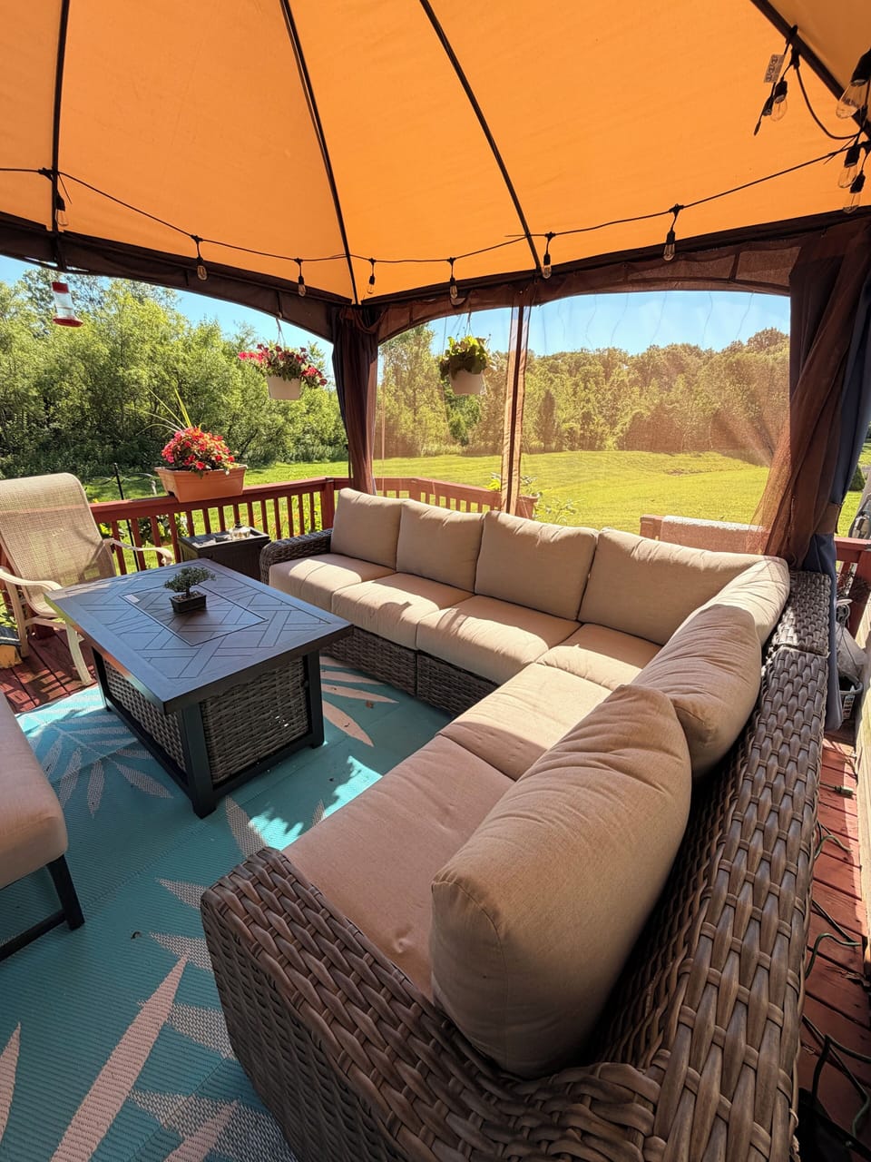 Enjoy day or night in the lit gazebo with cozy oversized seating and fire pit