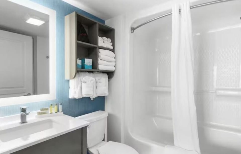 Refresh in a spotless bath with plush towels and amenities.