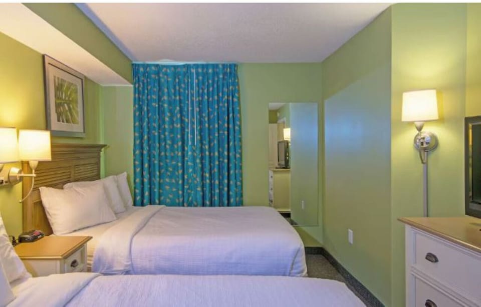 Settle into crisp linens for restful nights by the shore.