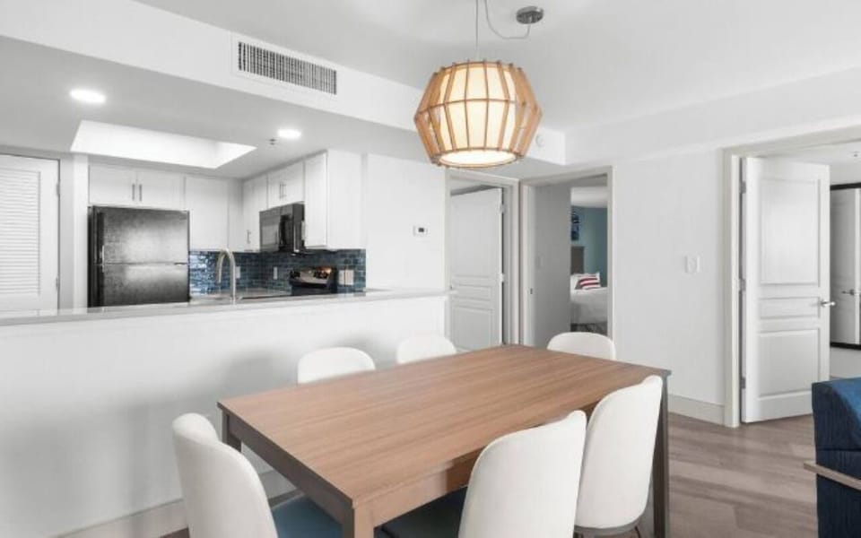 Share relaxed dinners under warm lighting after beach days.