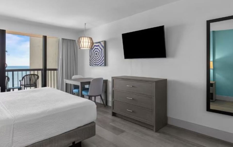 Wake up to ocean breezes from your bright bedroom.