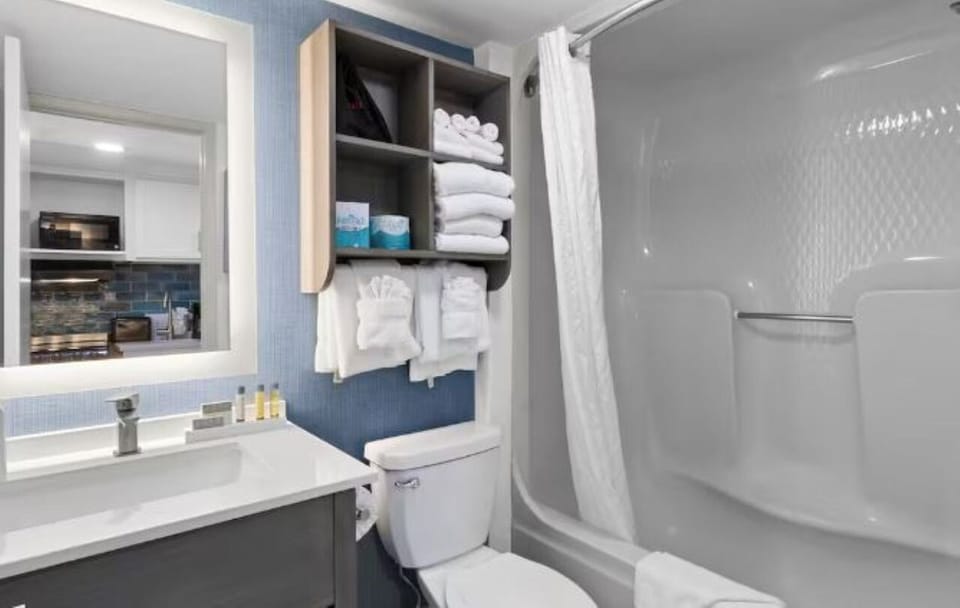 Refresh with a bright vanity and relaxing shower-tub combo.