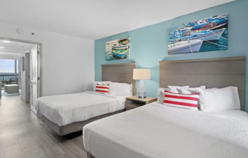 Drift off on crisp linens in a calm coastal bedroom.