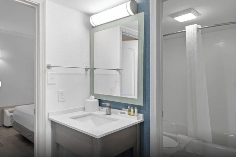 Refresh easily with bright vanity lighting and a clean shower.