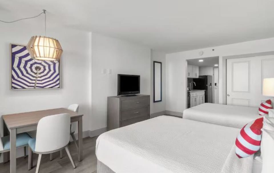 Unwind in a bright studio layout with cozy seating.