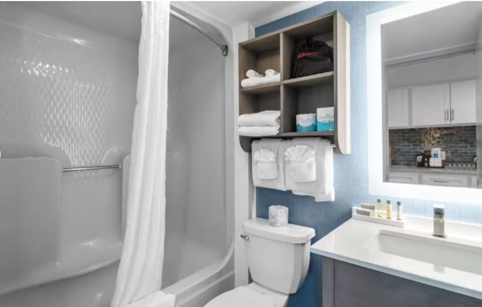 Refresh effortlessly in a bright bath with stocked essentials.