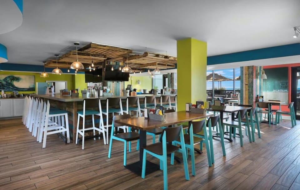 Sip handcrafted drinks at the lively bar after sunset.