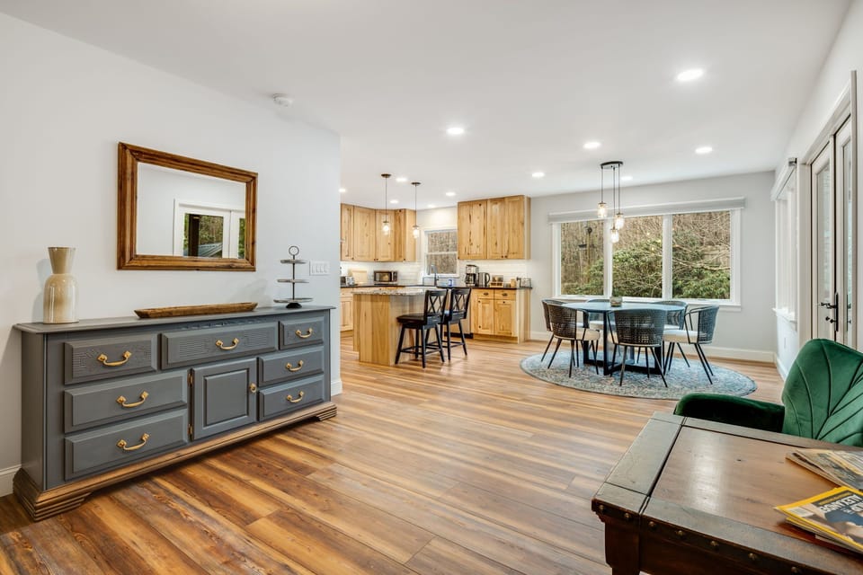 The kitchen and living room are seamlessly connected with a sitting area.