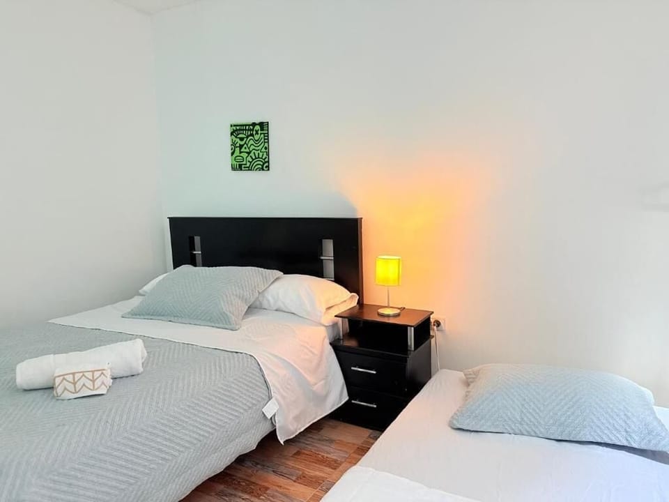 Traditional Loft | Desk, laptop workspace, blackout drapes, iron/ironing board
