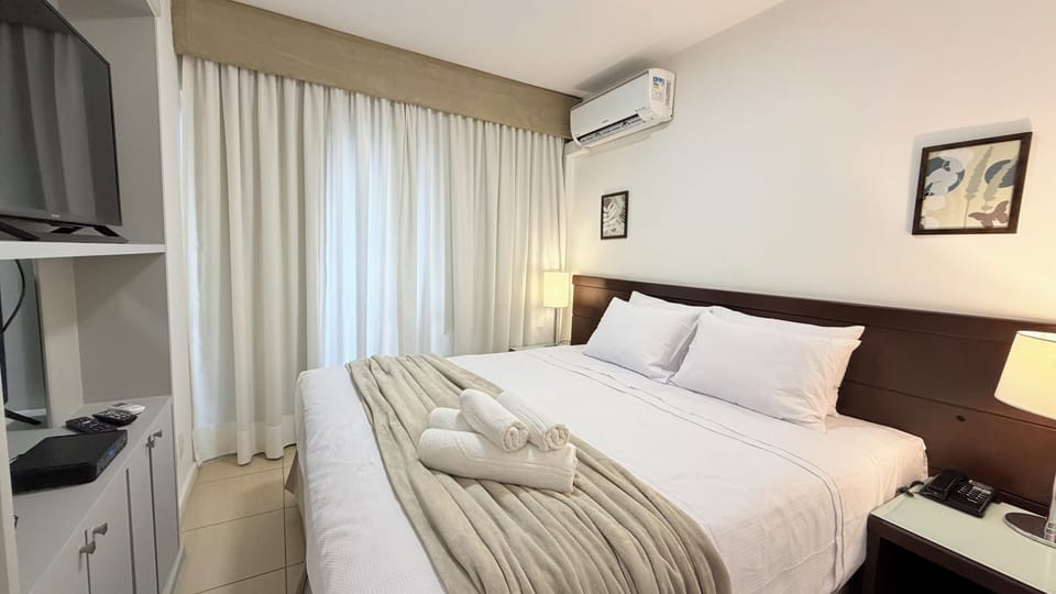 Deluxe Suite, 1 Queen Bed, City View | Desk, laptop workspace, iron/ironing board, WiFi (free)