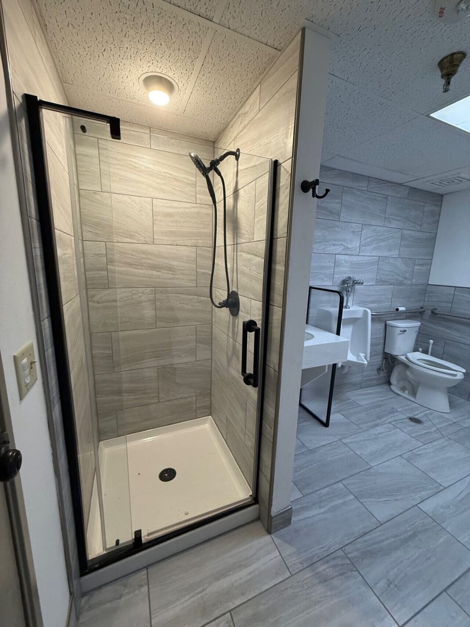 Clean and updated shared bathroom with walk-in shower and fresh finishes